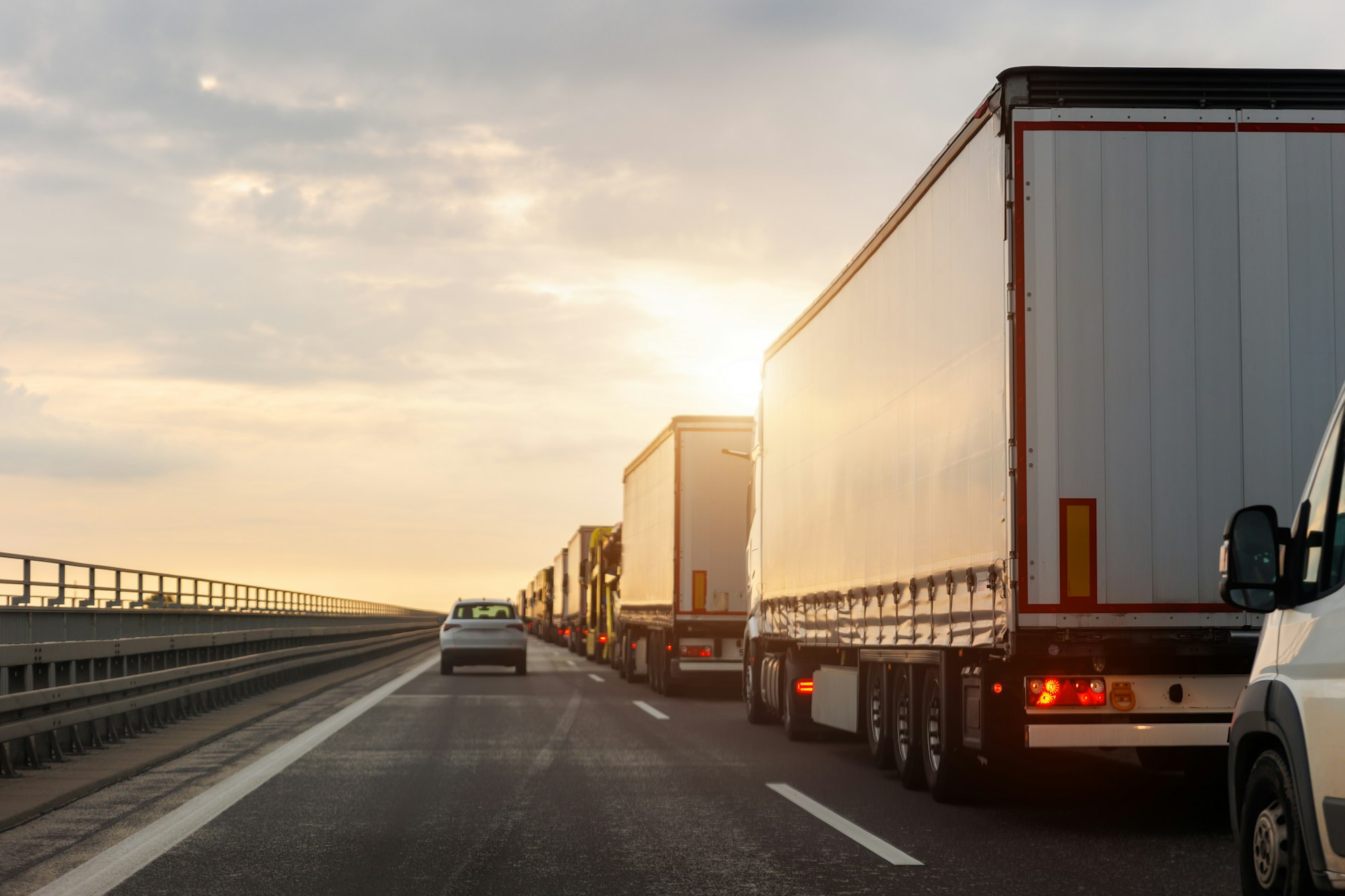 Queue of Trucks on Ukraine-Poland Border traffic jam at Sunset During Protest Roadblock. Business